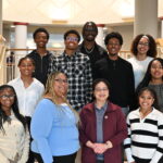 A group of HBCU STEM students pose with their institution president.