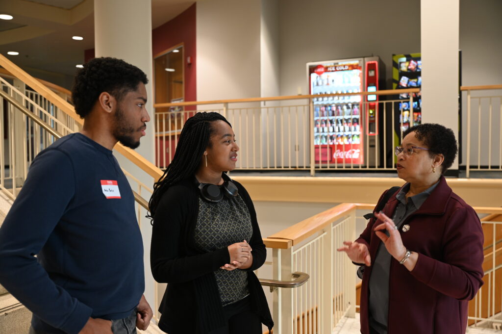 A group of HBCU students talk with their institution president.