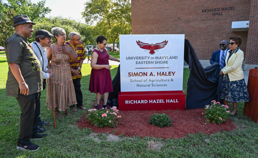 The Haley Family, from left, Bill Haley, Alan Haley, Anne Haley and Chris Haley, watch UMES President Heidi Anderson, left, pull the drape off the sign with the help of Moses Kairo, Dean of the School and Regent Yvette Lewis during the naming ceremony of the Simon A. Haley School of Agriculture & Natural Sciences on Tuesday, Sept. 8, 2026. (Photo by Todd Dudek, UMES Ag Communications)