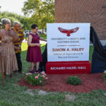 The Haley Family, from left, Bill Haley, Alan Haley, Anne Haley and Chris Haley, watch UMES President Heidi Anderson, left, pull the drape off the sign with the help of Moses Kairo, Dean of the School and Regent Yvette Lewis during the naming ceremony of the Simon A. Haley School of Agriculture & Natural Sciences on Tuesday, Sept. 8, 2026. (Photo by Todd Dudek, UMES Ag Communications)